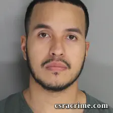 Aris Flores booking photo