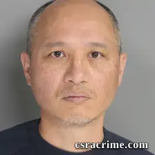 Guang Zheng booking photo