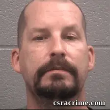 John Clarke booking photo