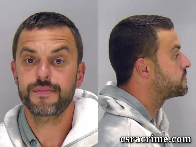 Paul Banks JR booking photo